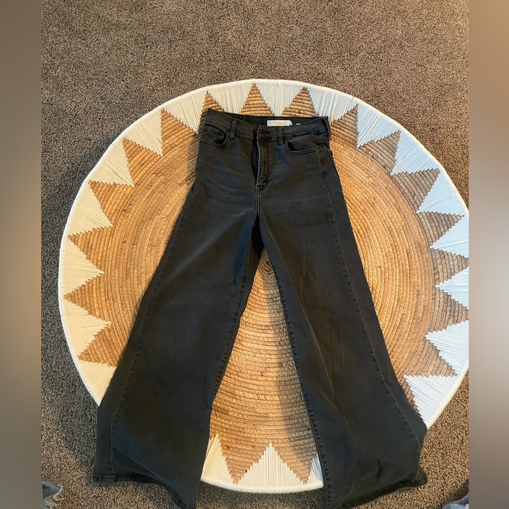Hidden black washed loose bottom jeans